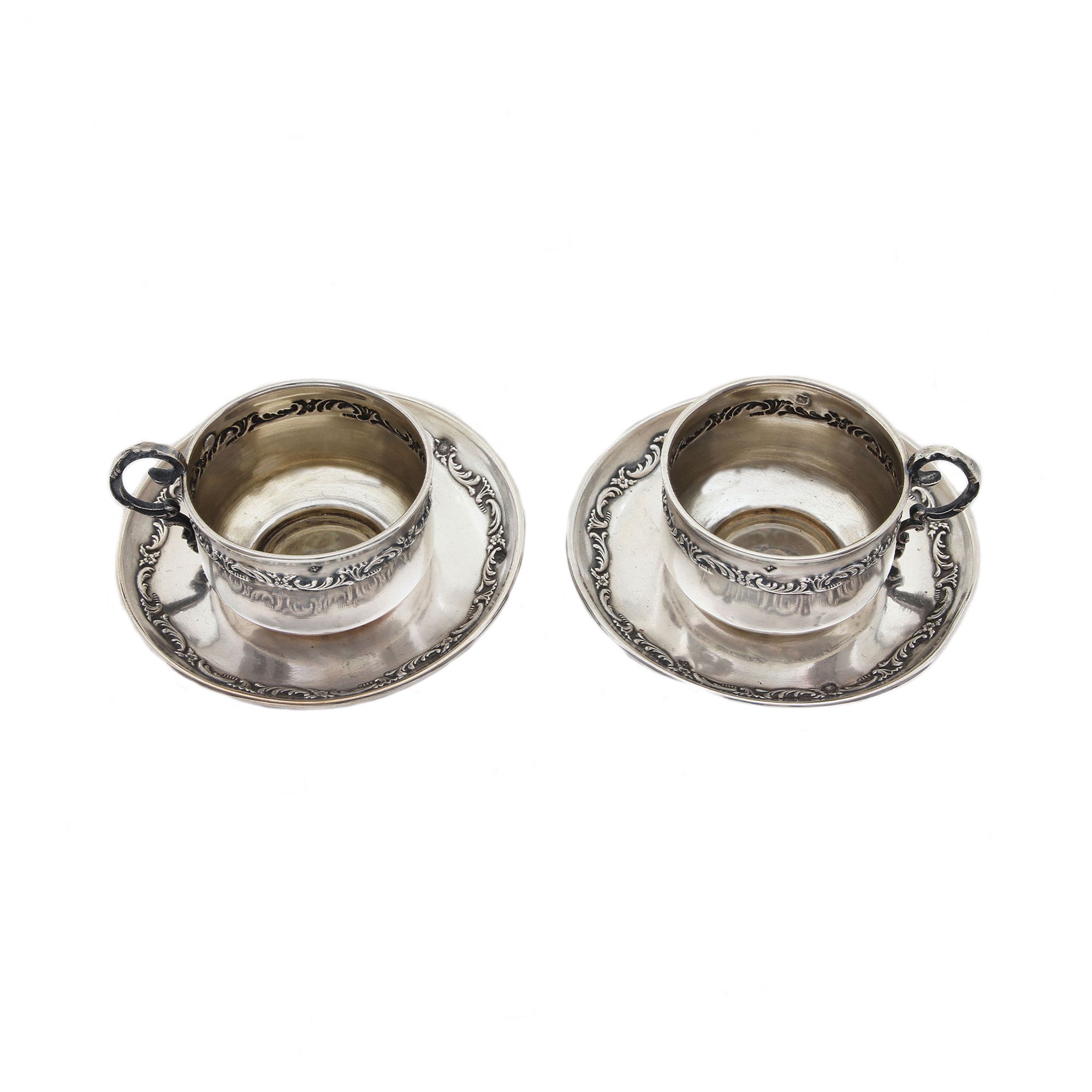 French miniature cup and saucer set with floral detailing