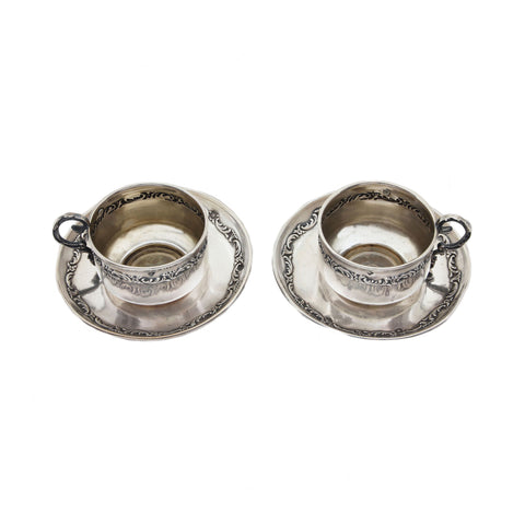 French miniature cup and saucer set with floral detailing