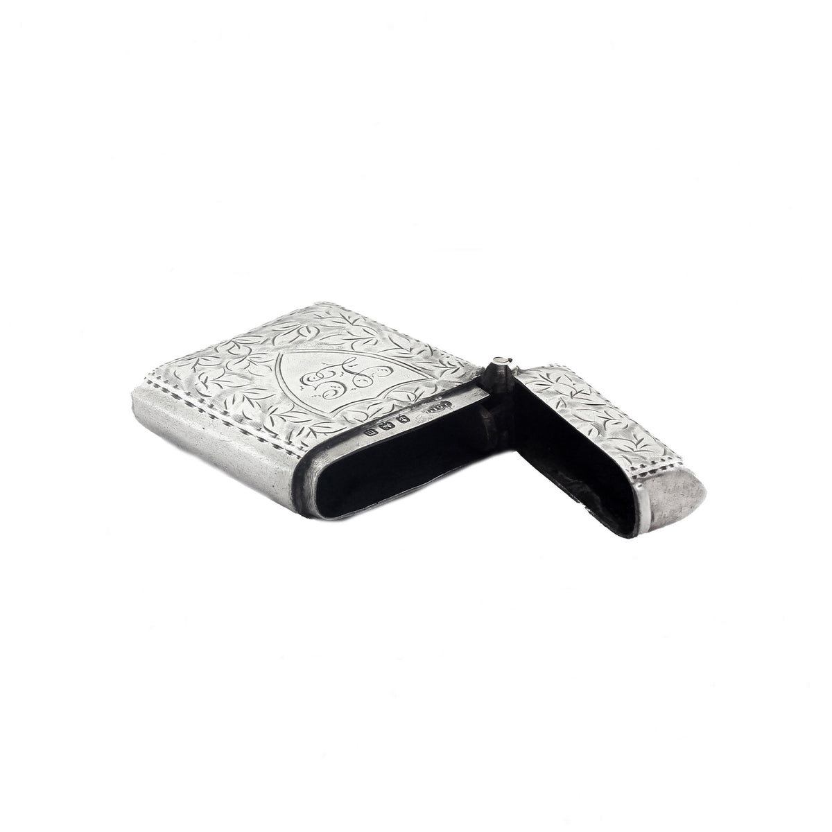 Silver vesta case with floral engraving on a white background