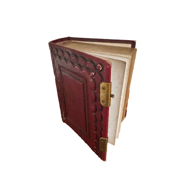 victorian red leather book with gold hardware on a white background