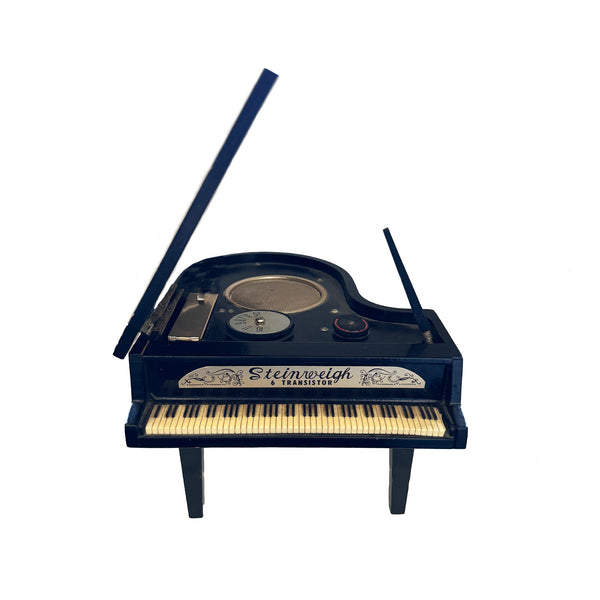 Model of a Steinweigh grand piano on a white background