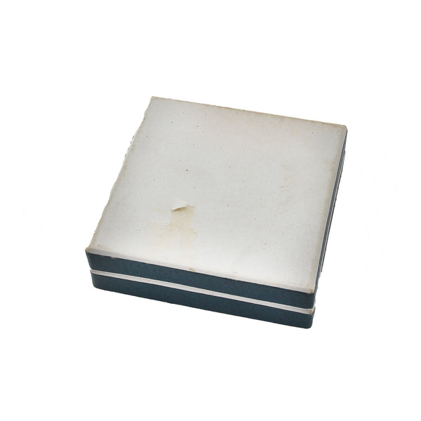 White rectangular object with a blue stripe on a white background