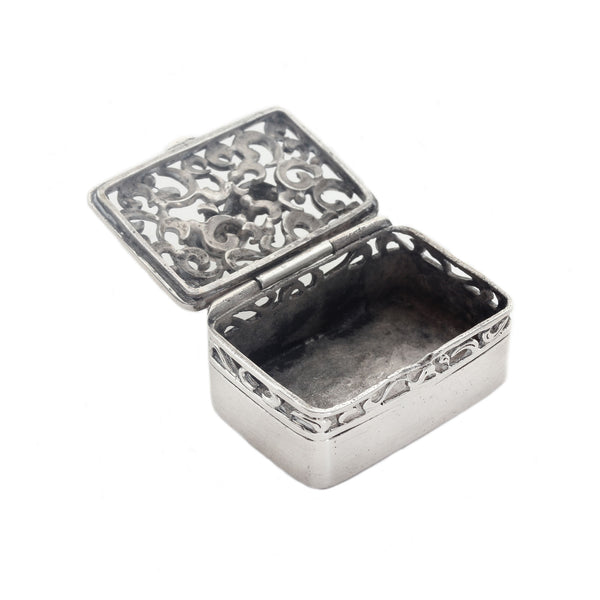 Silver decorative box with intricate patterns on a white background