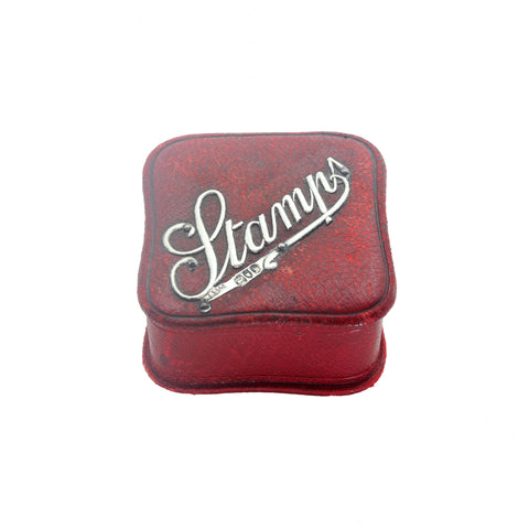 Red stamp case with 'Stamps' branding on a white background