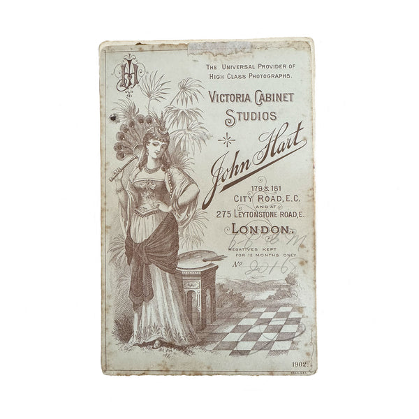 Vintage-style advertisement card for Victoria Cabinet Studios with a woman holding a fan on a white background.