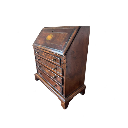 Wooden slant-front desk on a white background
