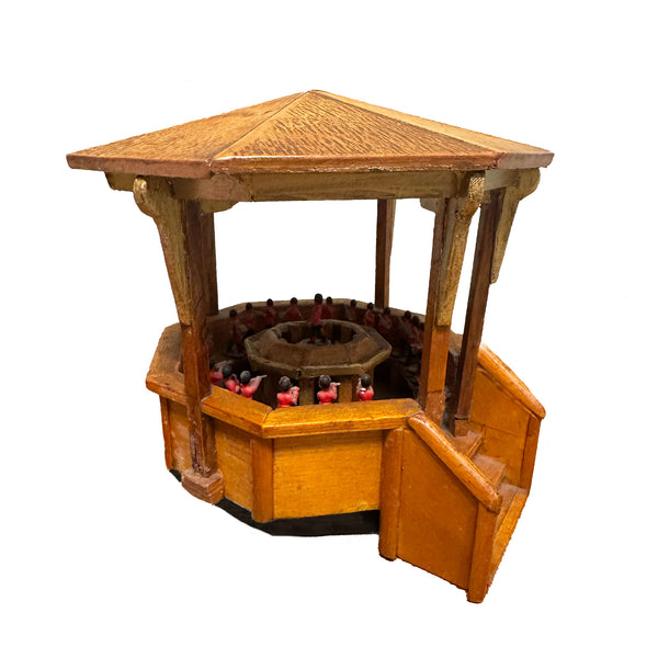 Wooden model of a bandstand with a white background