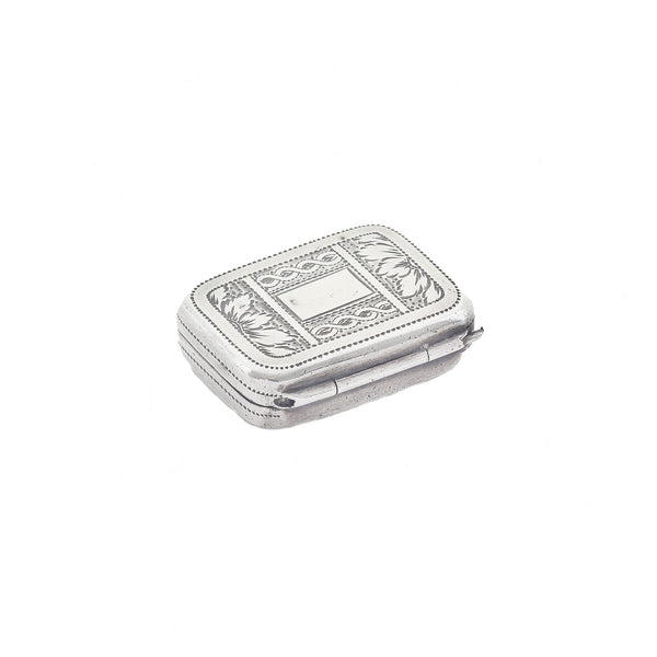 Silver jewelry box with intricate designs on a white background