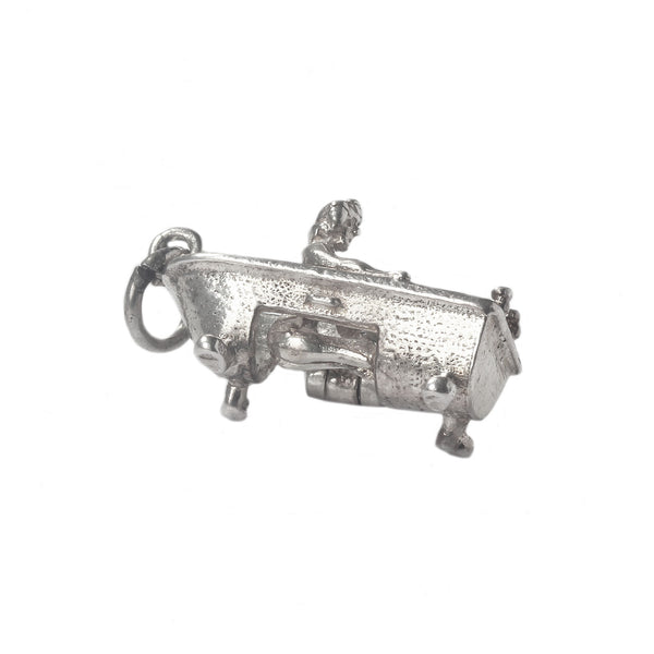 Silver woman in bath charm on a white background