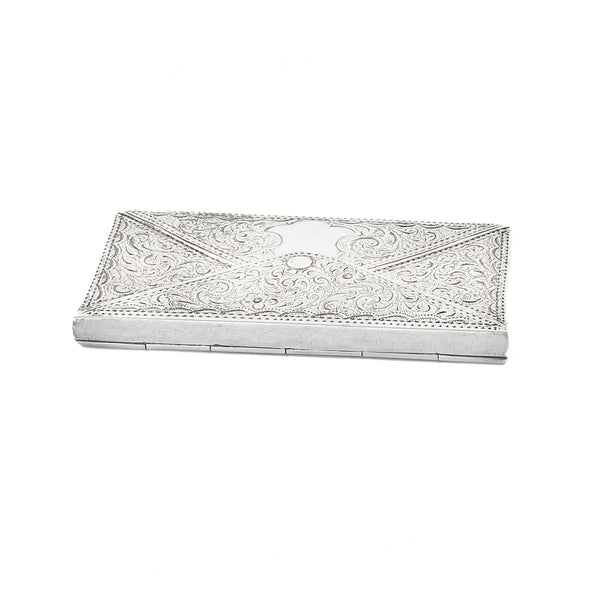 Silver card holder with intricate patterns on a white background