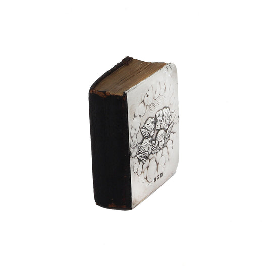 Small book with black and white design on a white background