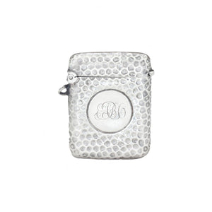 Silver textured vesta with monogram on a white background
