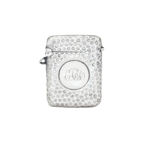 Silver textured vesta with monogram on a white background