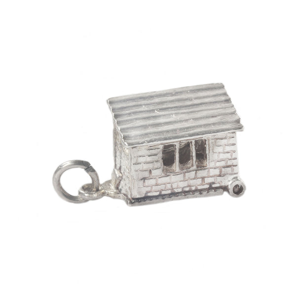 Silver cottage horse box charm on a white background