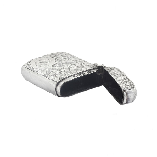 Silver match case with intricate design on a white background