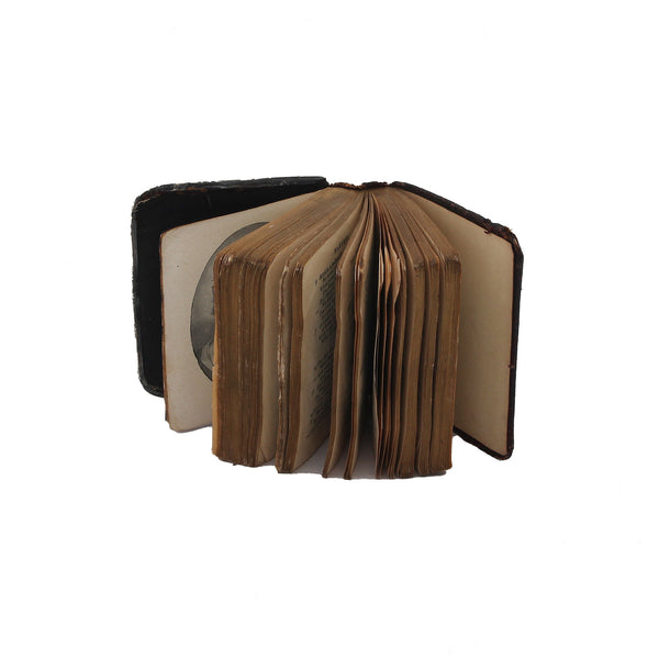 Open vintage book on a white background