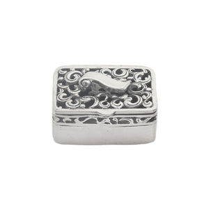 Decorative silver box with intricate patterns on a white background