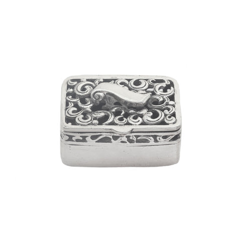 Decorative silver box with intricate patterns on a white background
