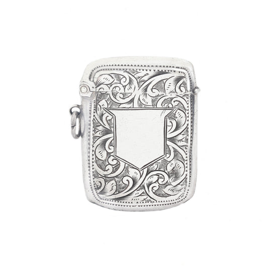 Silver vesta case case with intricate floral patterns on a white background