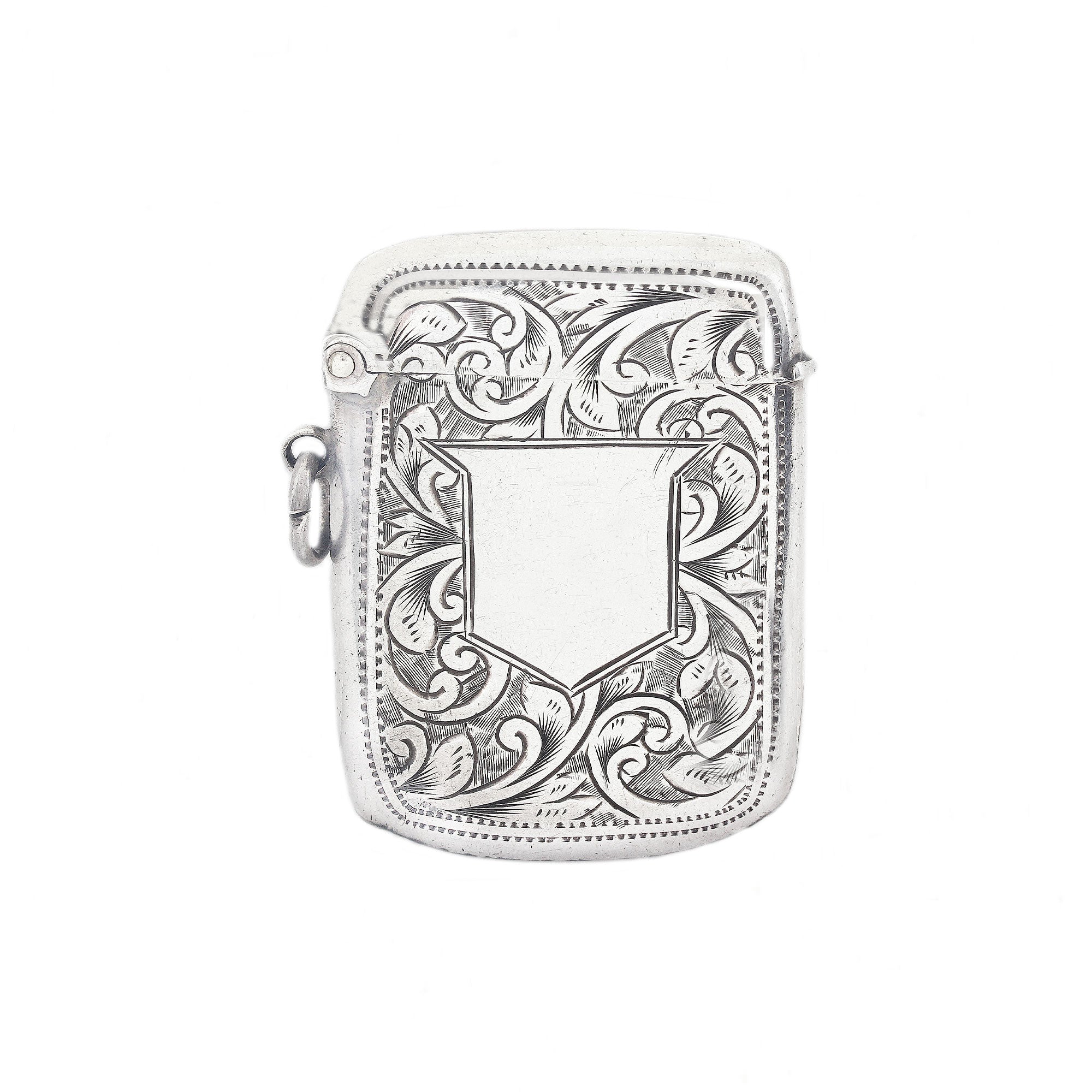 Silver vesta case case with intricate floral patterns on a white background