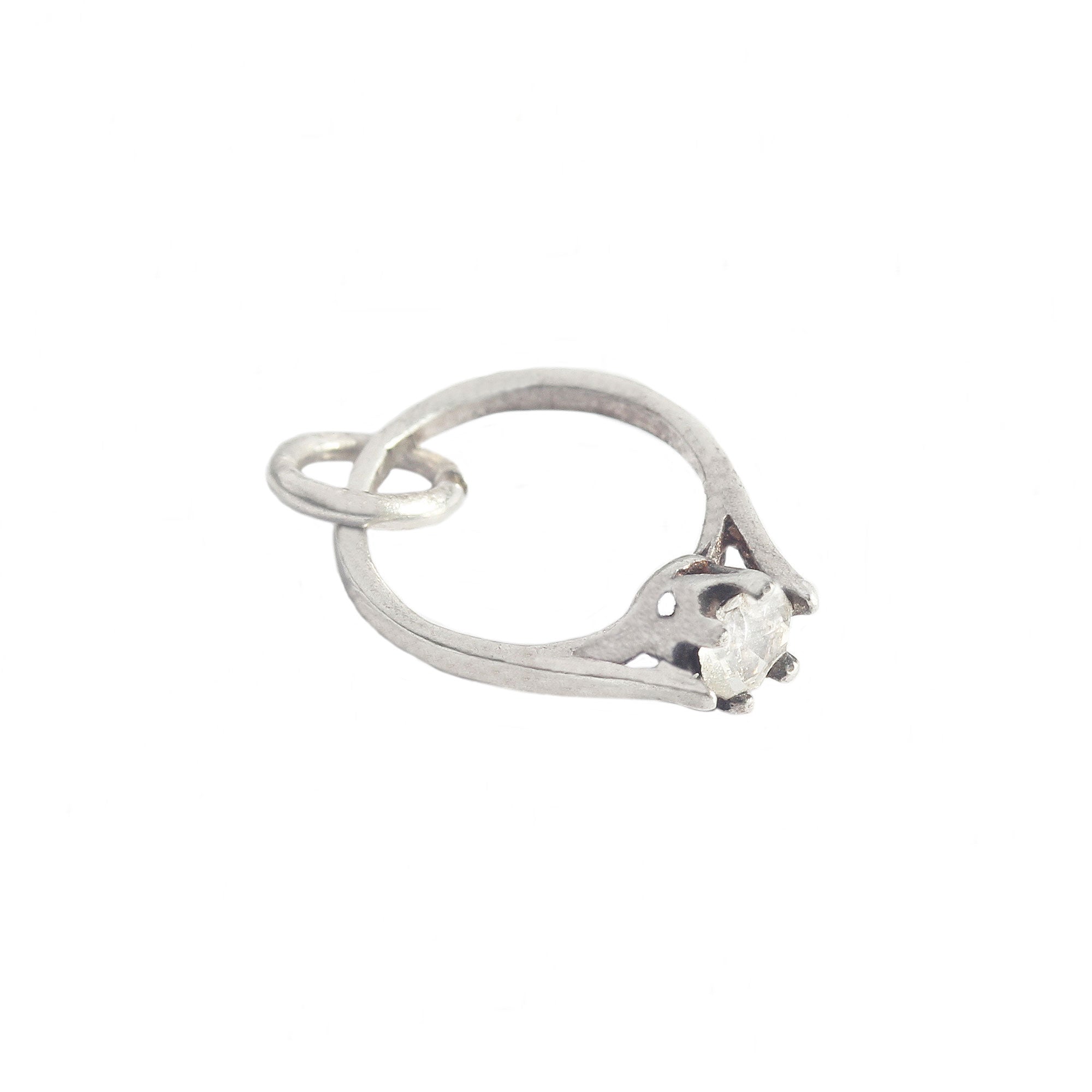 Silver ring with a stone on a white background