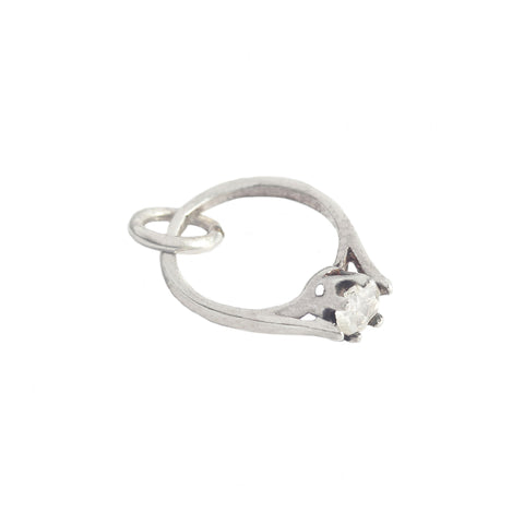 Silver ring with a stone on a white background
