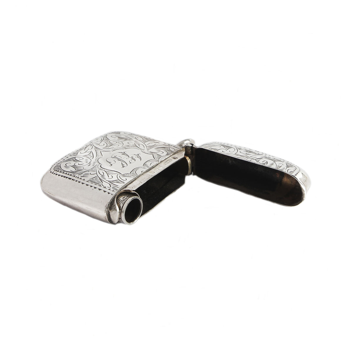 Silver vesta with intricate designs on a white background