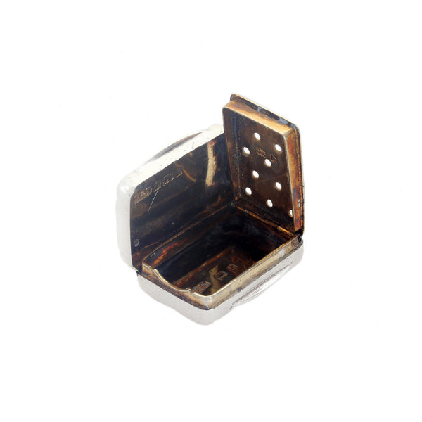 Small vinaigrette with open lid on a white background