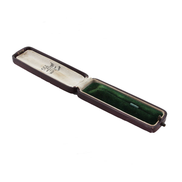 Open jewellery box with green interior on a white background