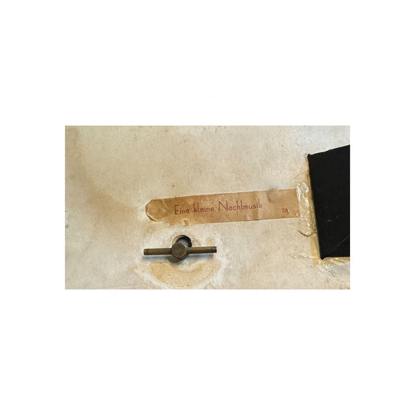 Decorative wall piece with text on a textured beige background