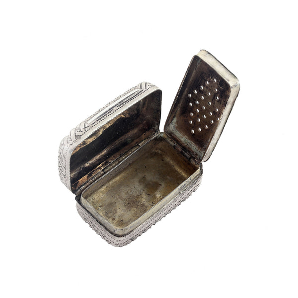 Silver box with intricate designs on a white background