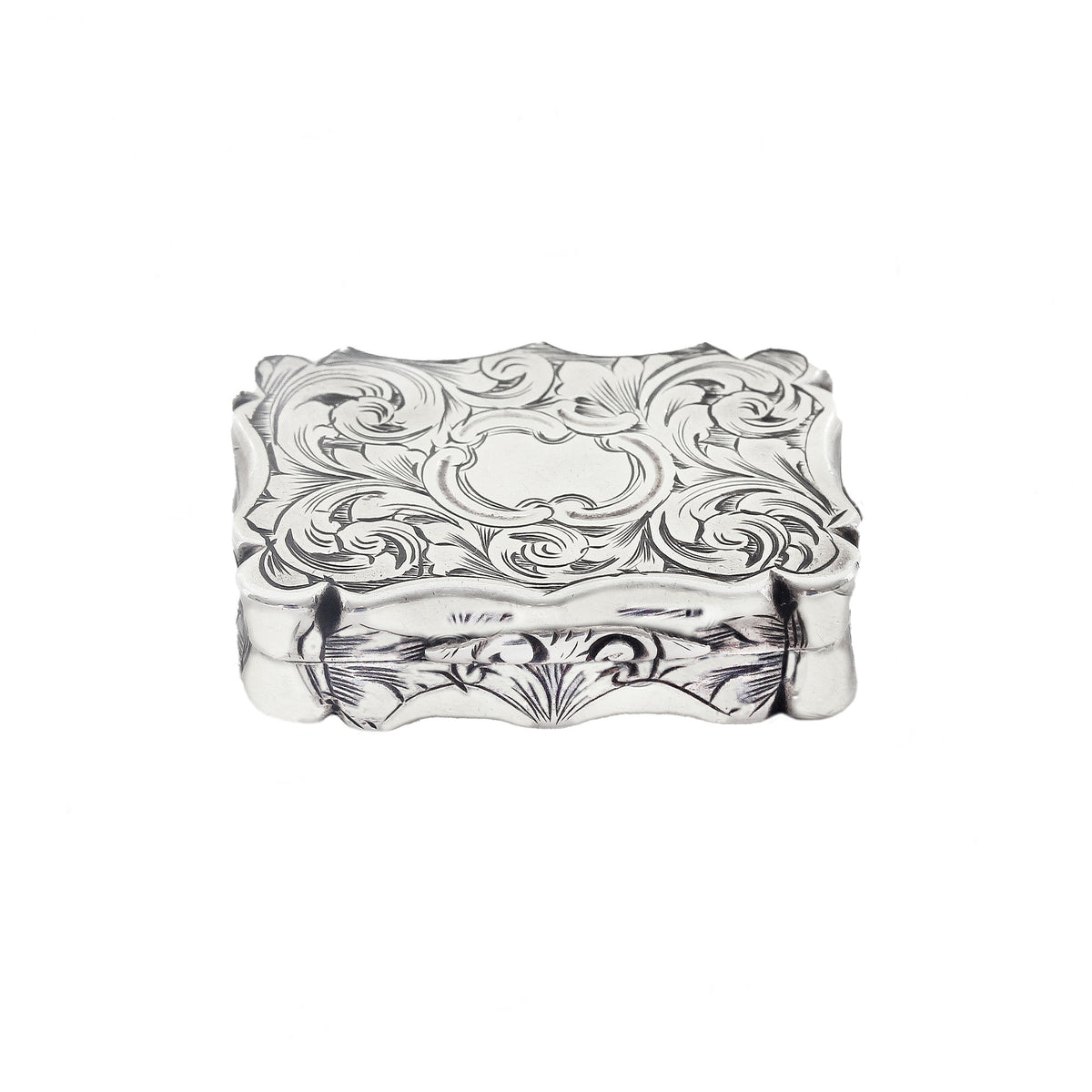 Decorative silver box with intricate patterns on a white background