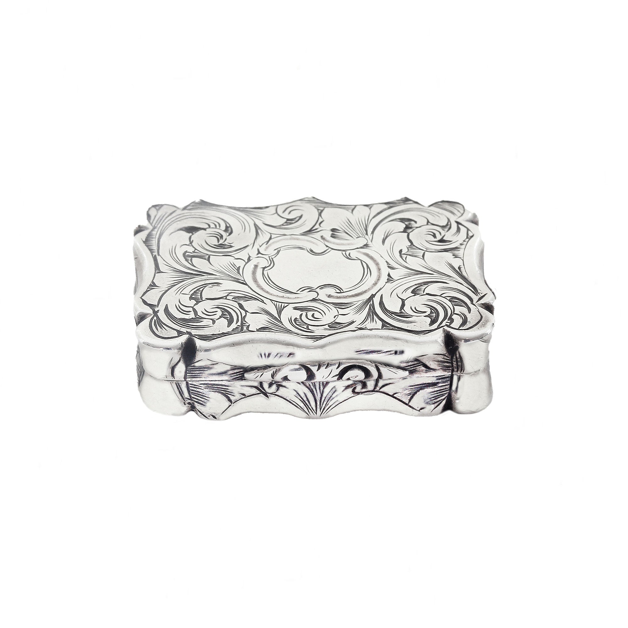 Decorative silver box with intricate patterns on a white background