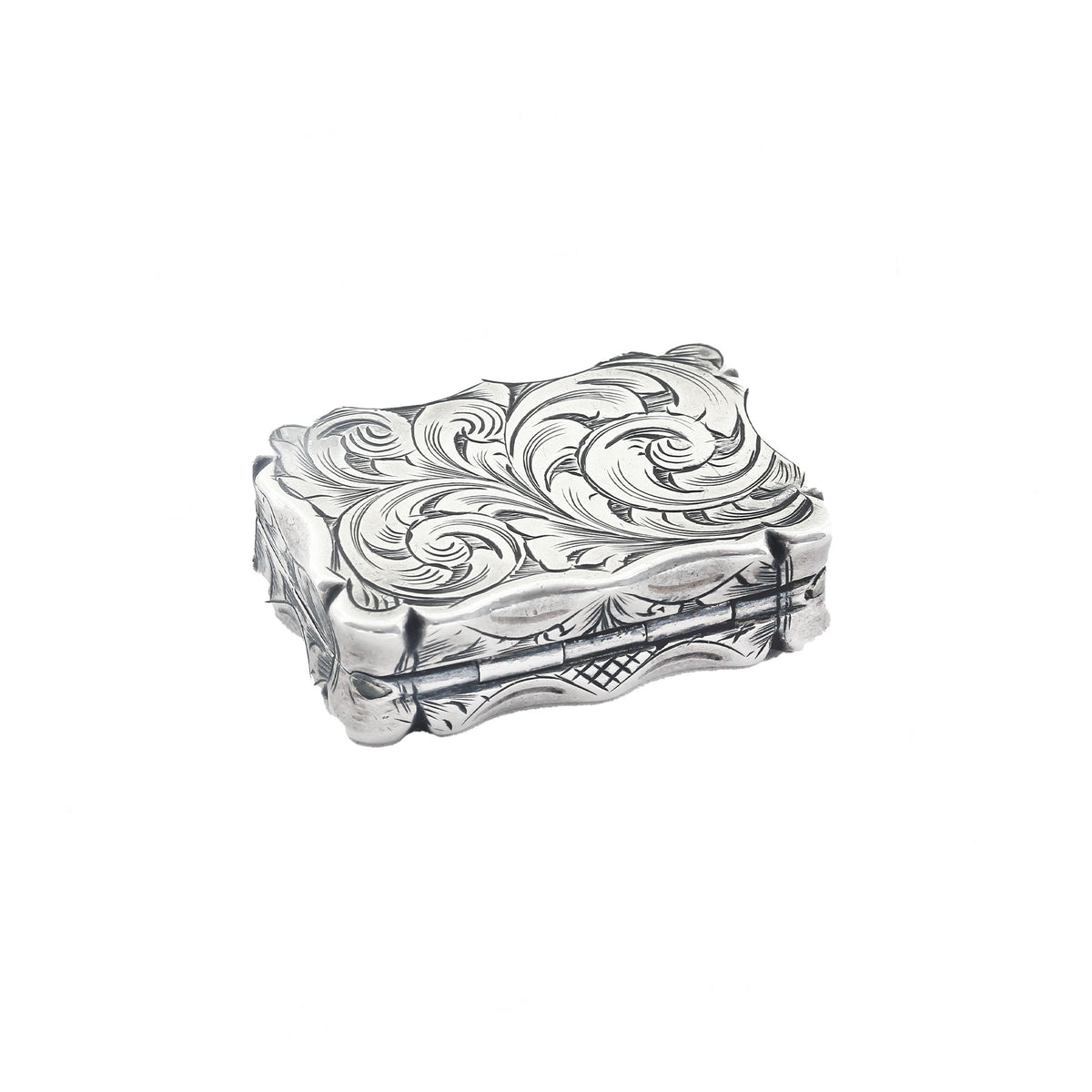 Silver decorative box with intricate patterns on a white background