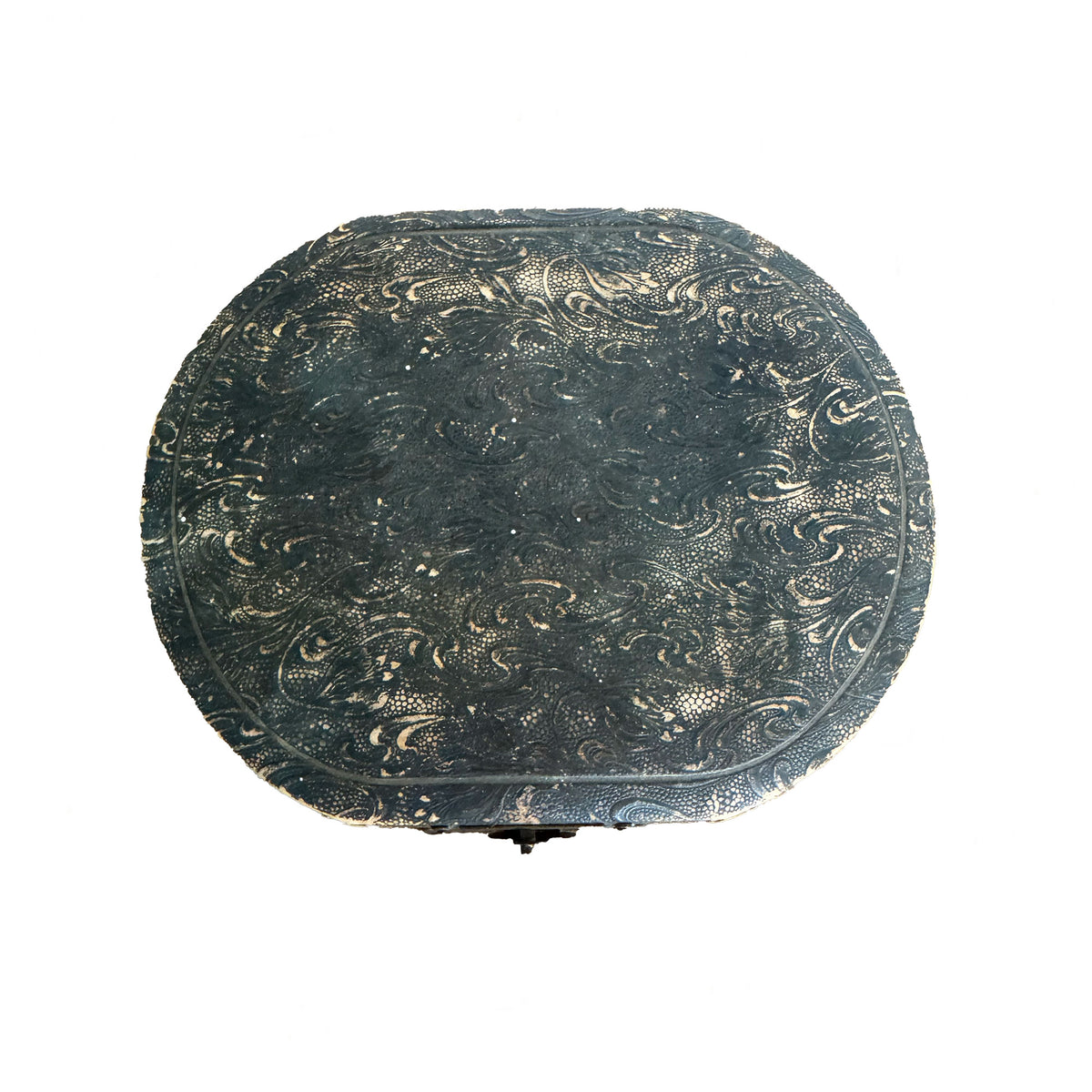 Decorative round object with intricate patterns on a white background