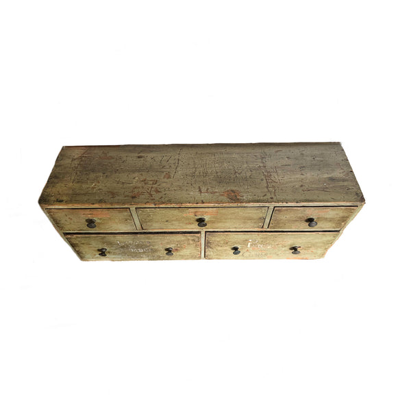 Wooden dresser with multiple drawers on a white background