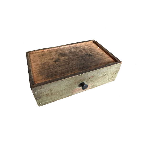 Wooden box with a dark brown lid and light wood body on a white background
