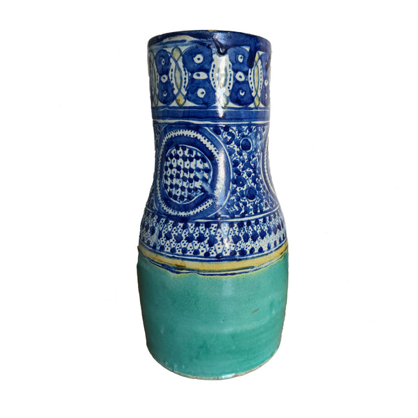 Ceramic vase with blue and white pattern on a white background
