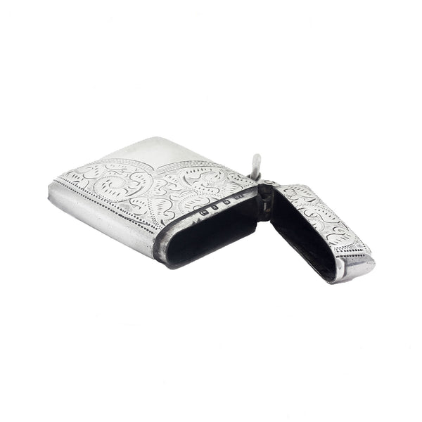 Decorative silver case with intricate designs on a white background