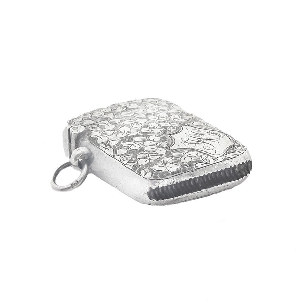 Silver vesta with floral pattern on a white background