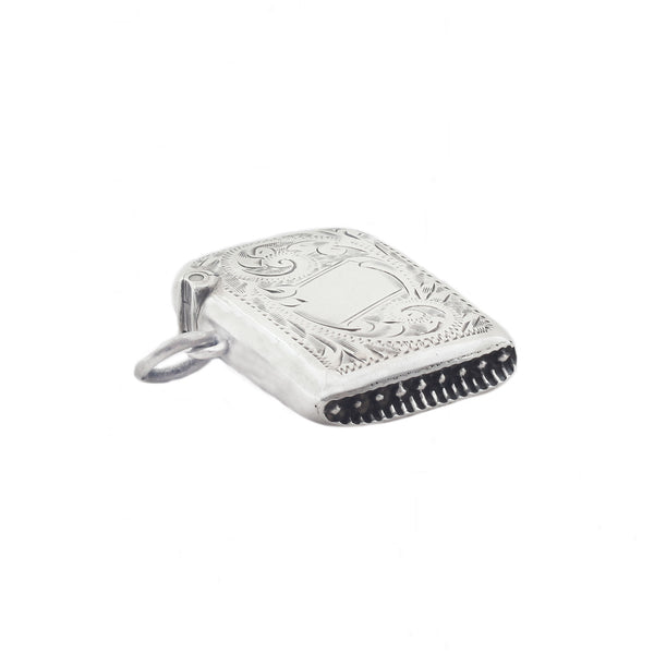 Silver vesta with intricate design on a white background