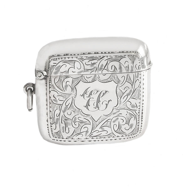 Silver engraved case with initials on a white background