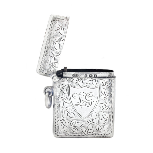 Decorative vesta with floral patterns and a central emblem on a white background