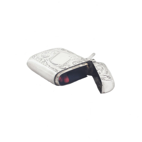 Silver vesta case with engraved design on a white background