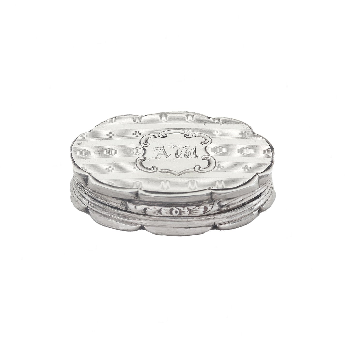 Silver vinaigrette with 'AM' engraving on a white background