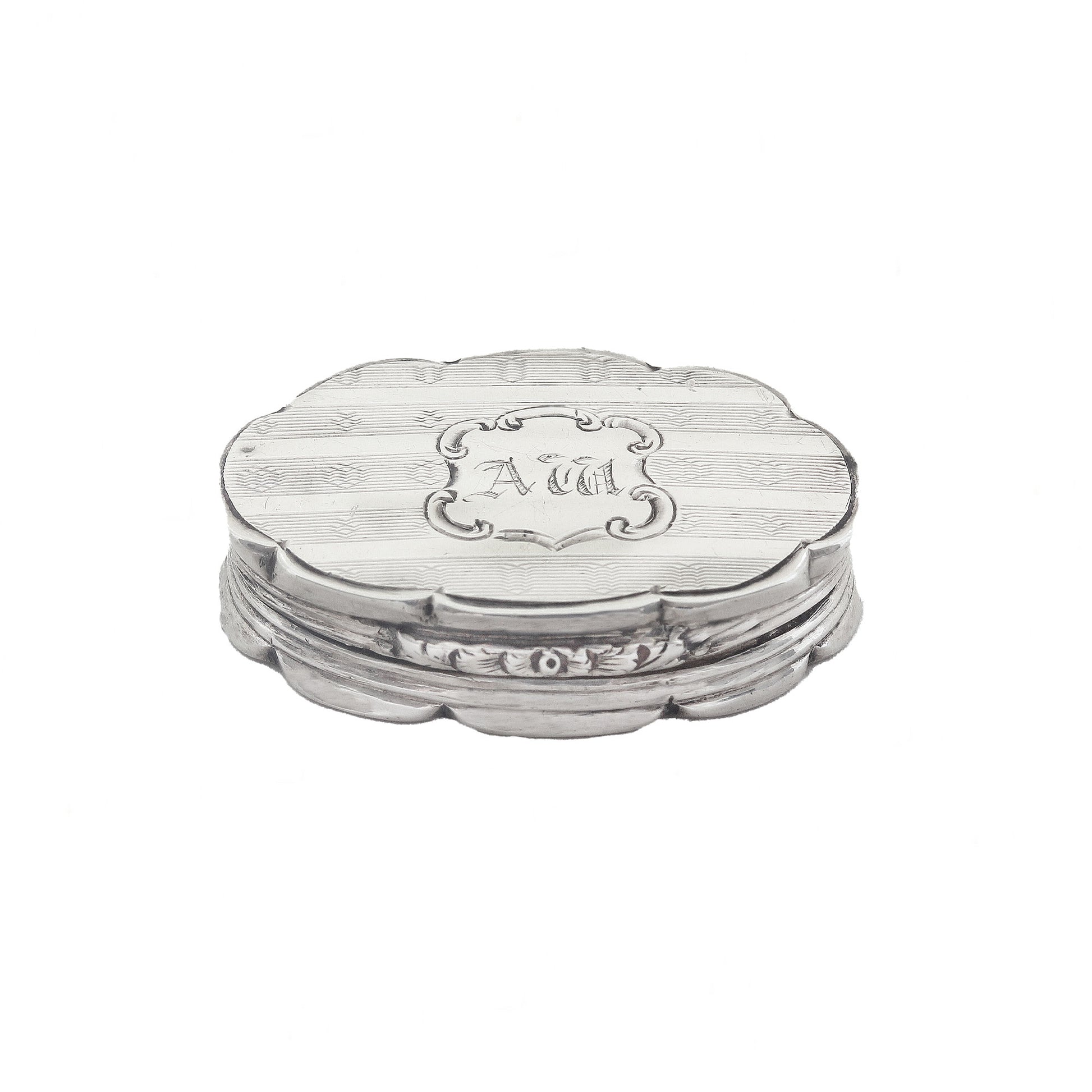 Silver vinaigrette with 'AM' engraving on a white background