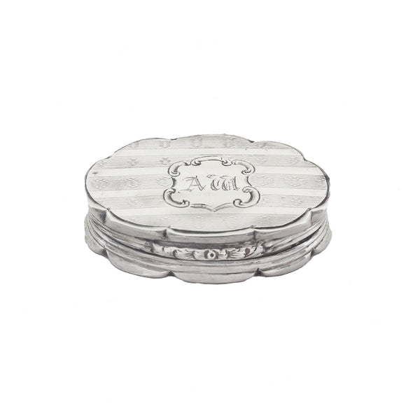 Silver vinaigrette with 'AM' engraving on a white background