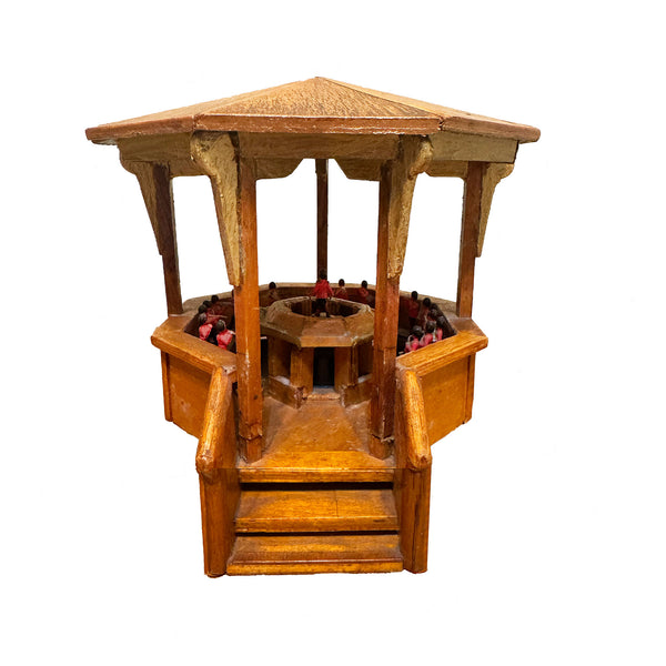 Wooden hexagonal bandstand with multiple small windows on a white background
