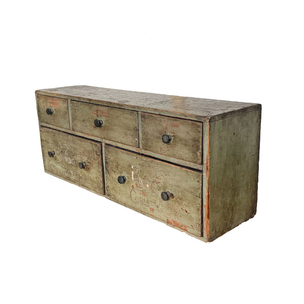 Vintage wooden dresser with multiple drawers on a white background