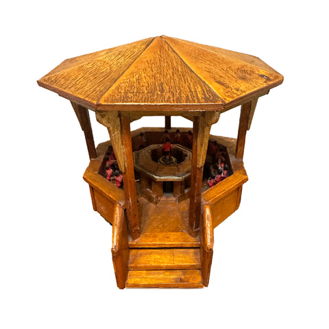 Wooden octagonal bandstand with steps on a white background